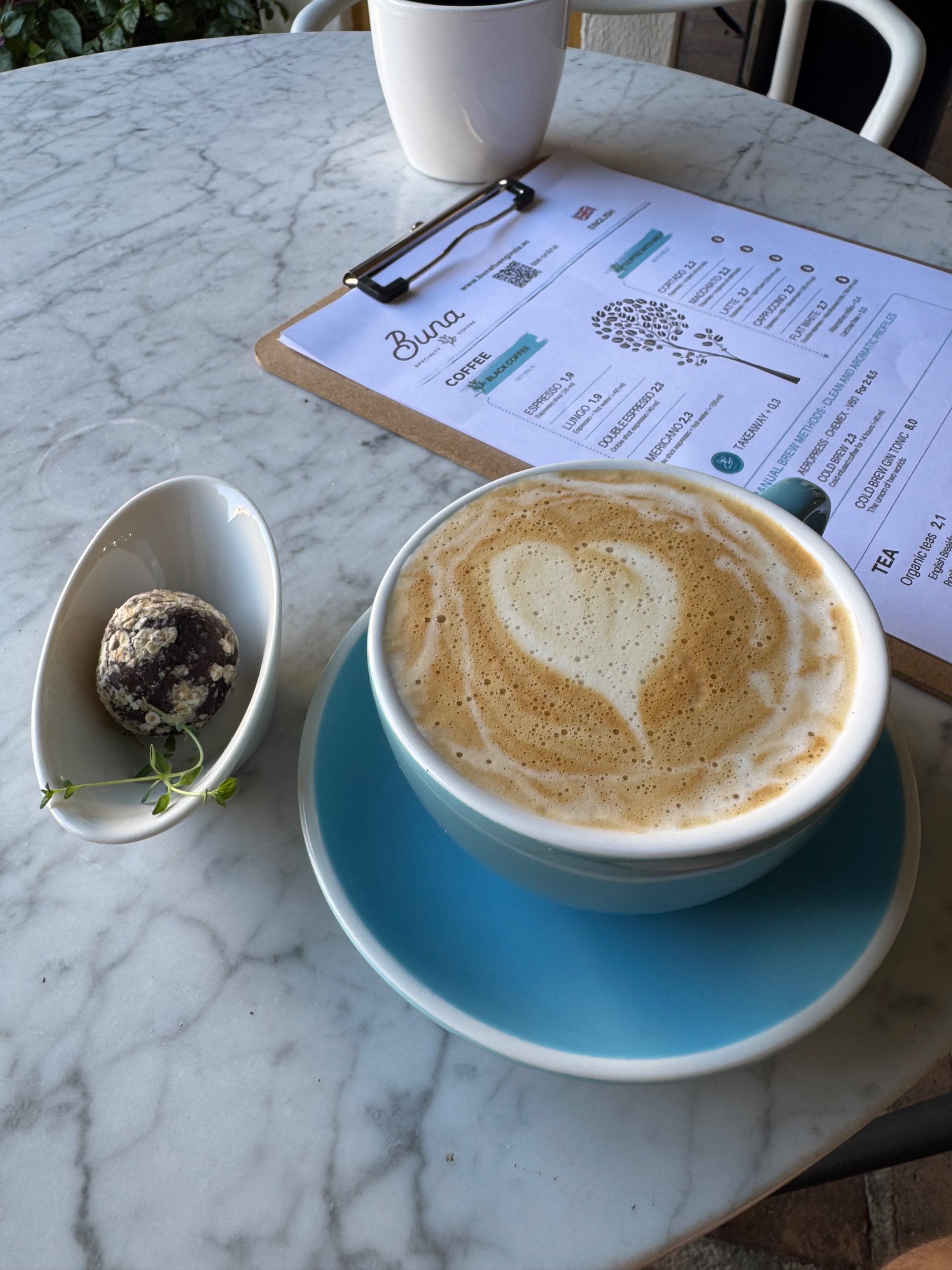 A heart-art latte and the Buna menu